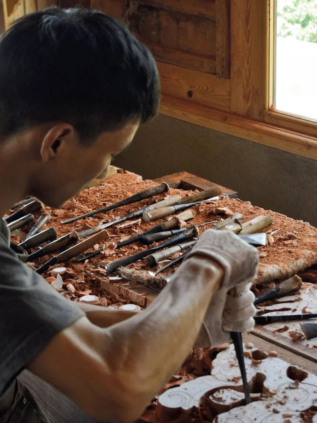 Shaxi Ancient Town — an artisan restoring carved wood