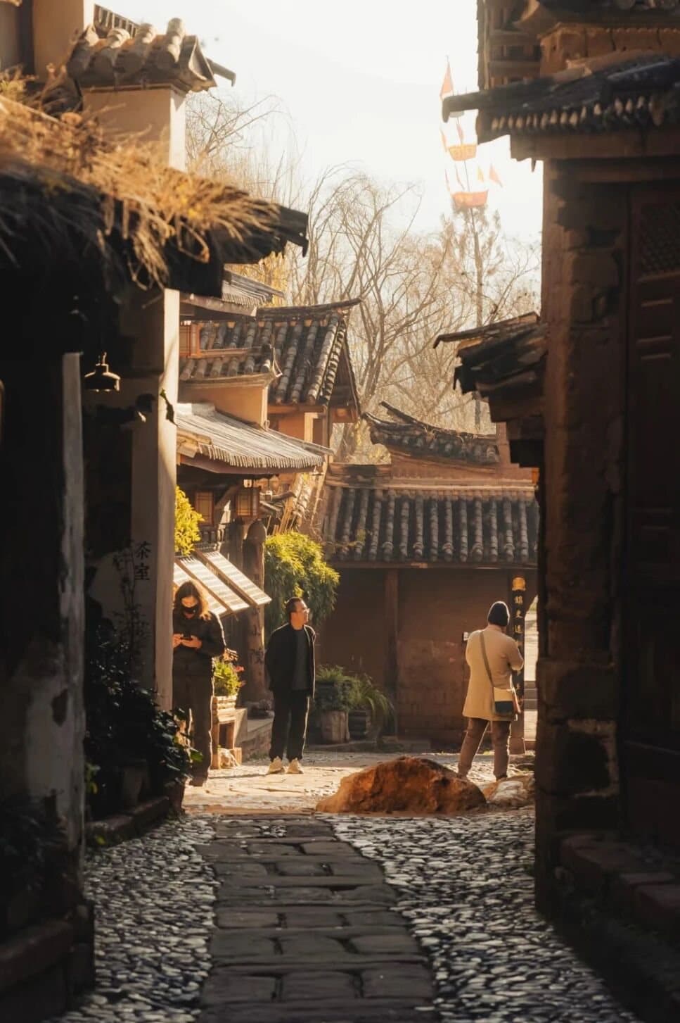 Shaxi Ancient Town — sunlight in a stone-paved lane