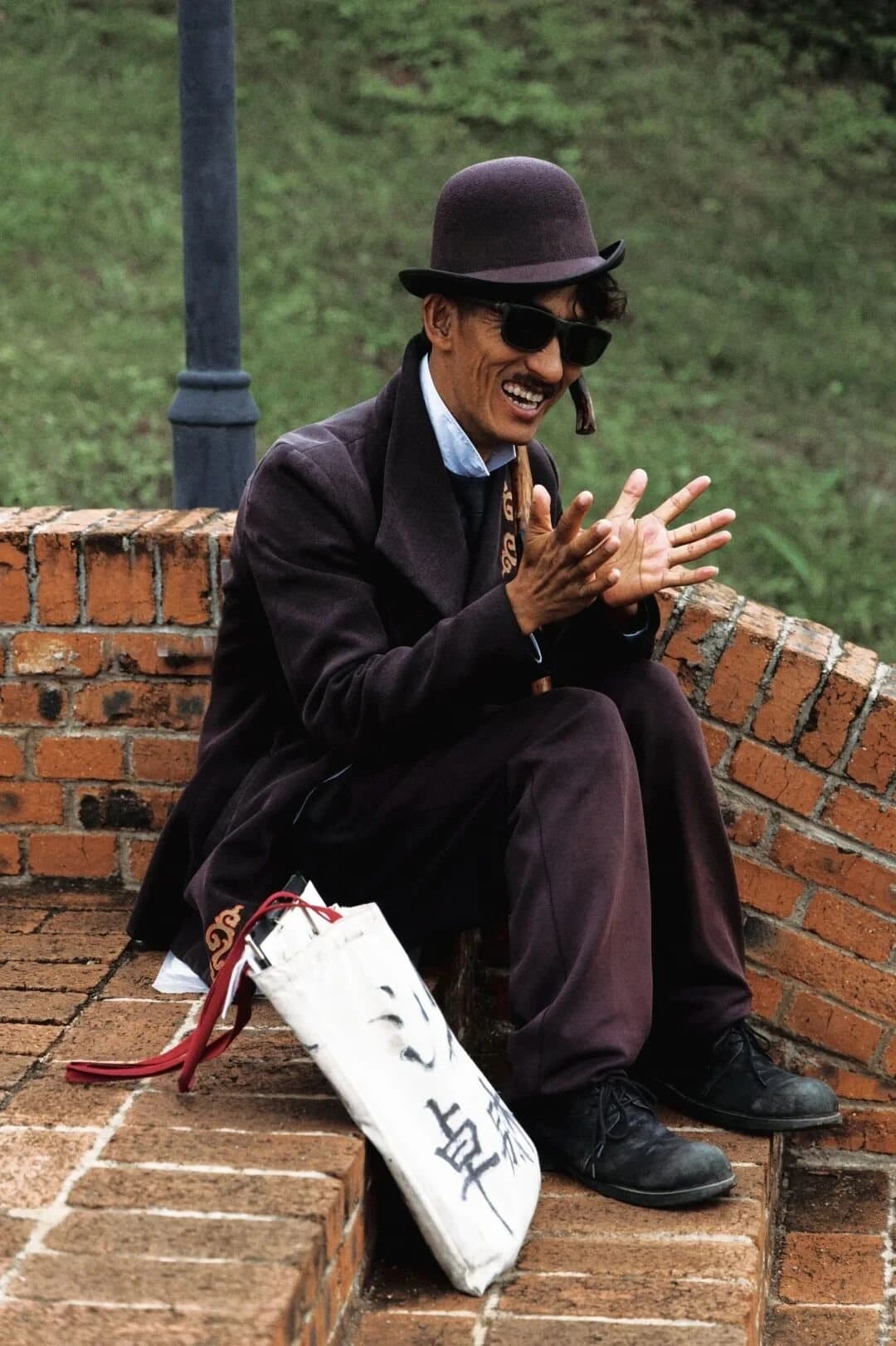 Shaxi Ancient Town — a local musician playing in the square