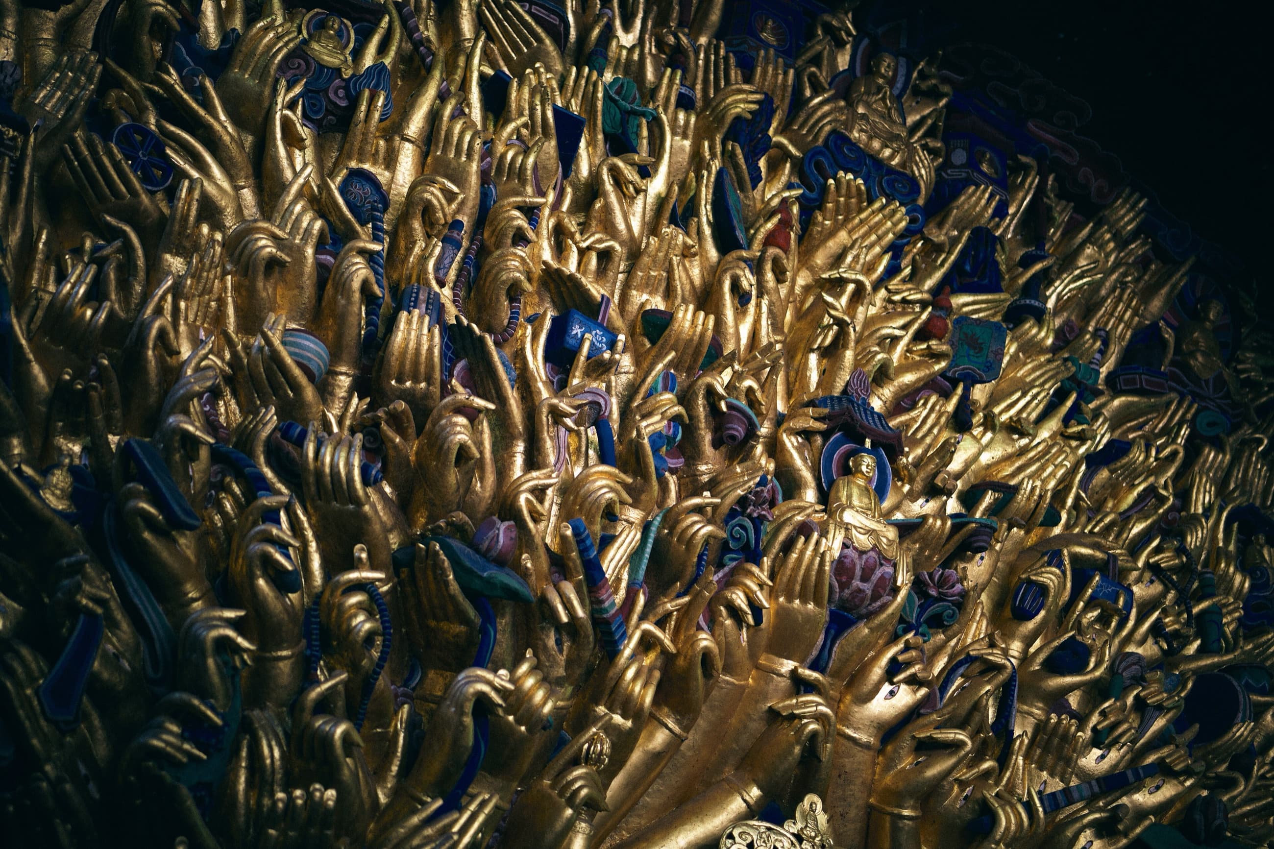 High-resolution detail of the central figure and surrounding hands