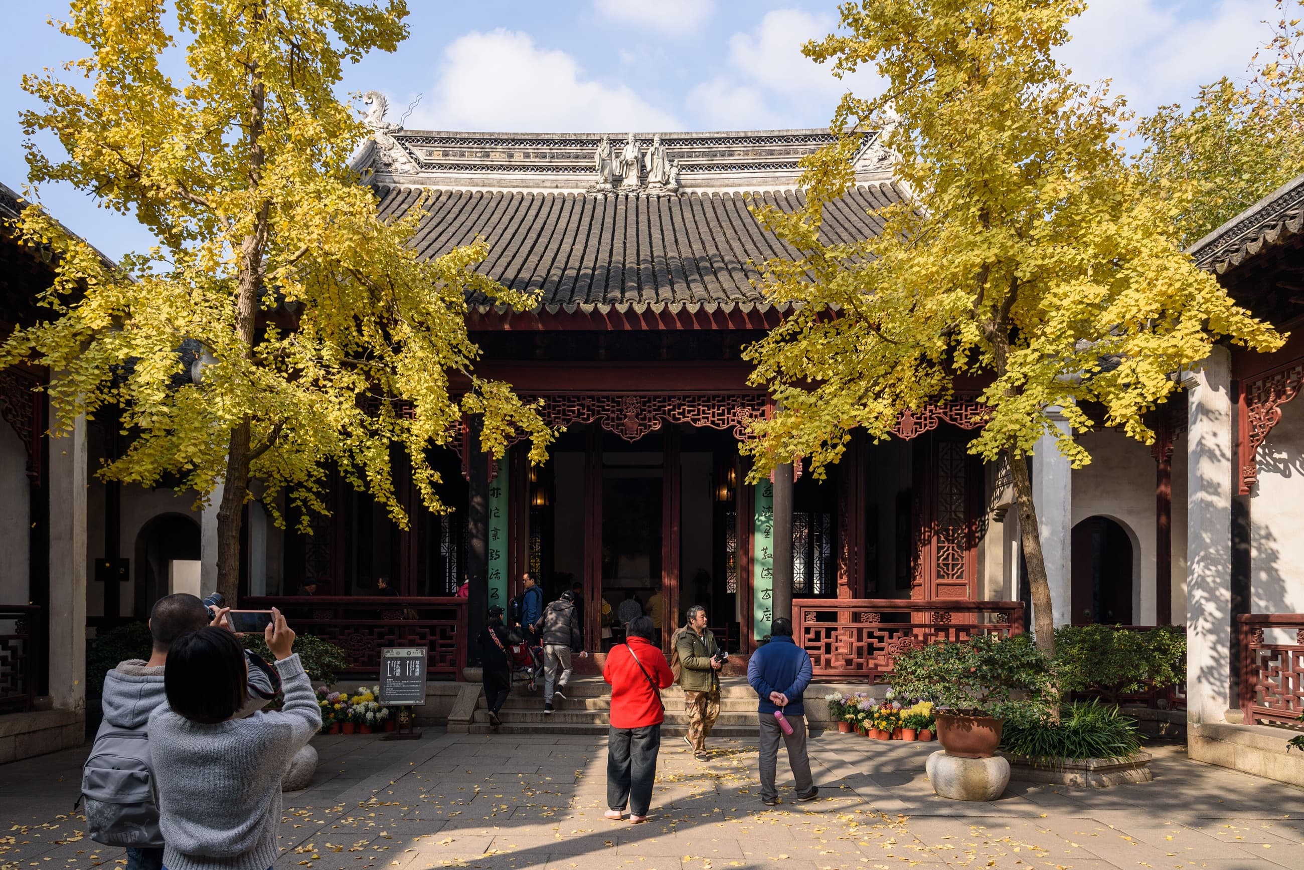 High-resolution view across the rockery, pond and pavilions of Lion Grove Garden
