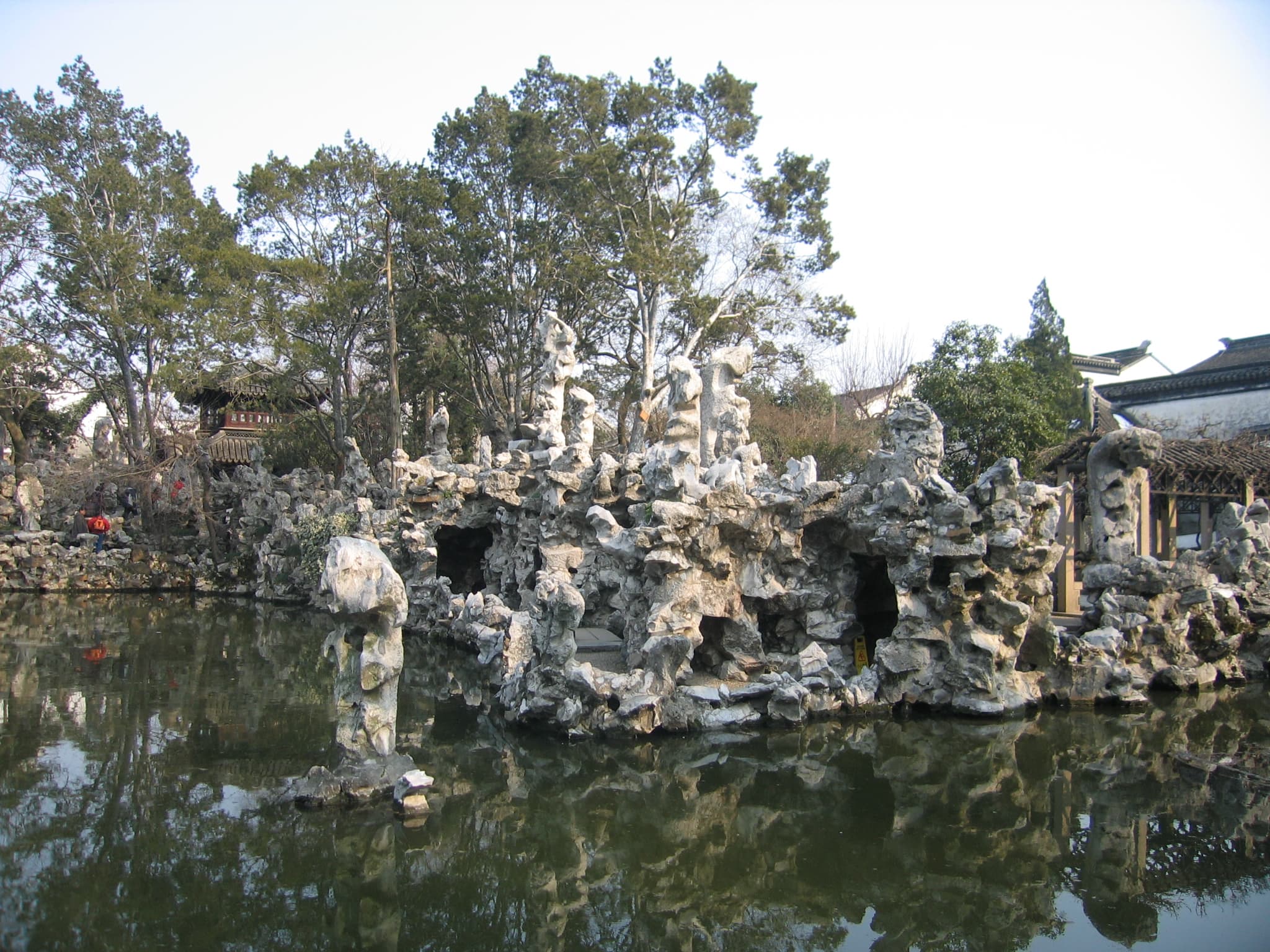 Garden architecture framed through rocks and planting