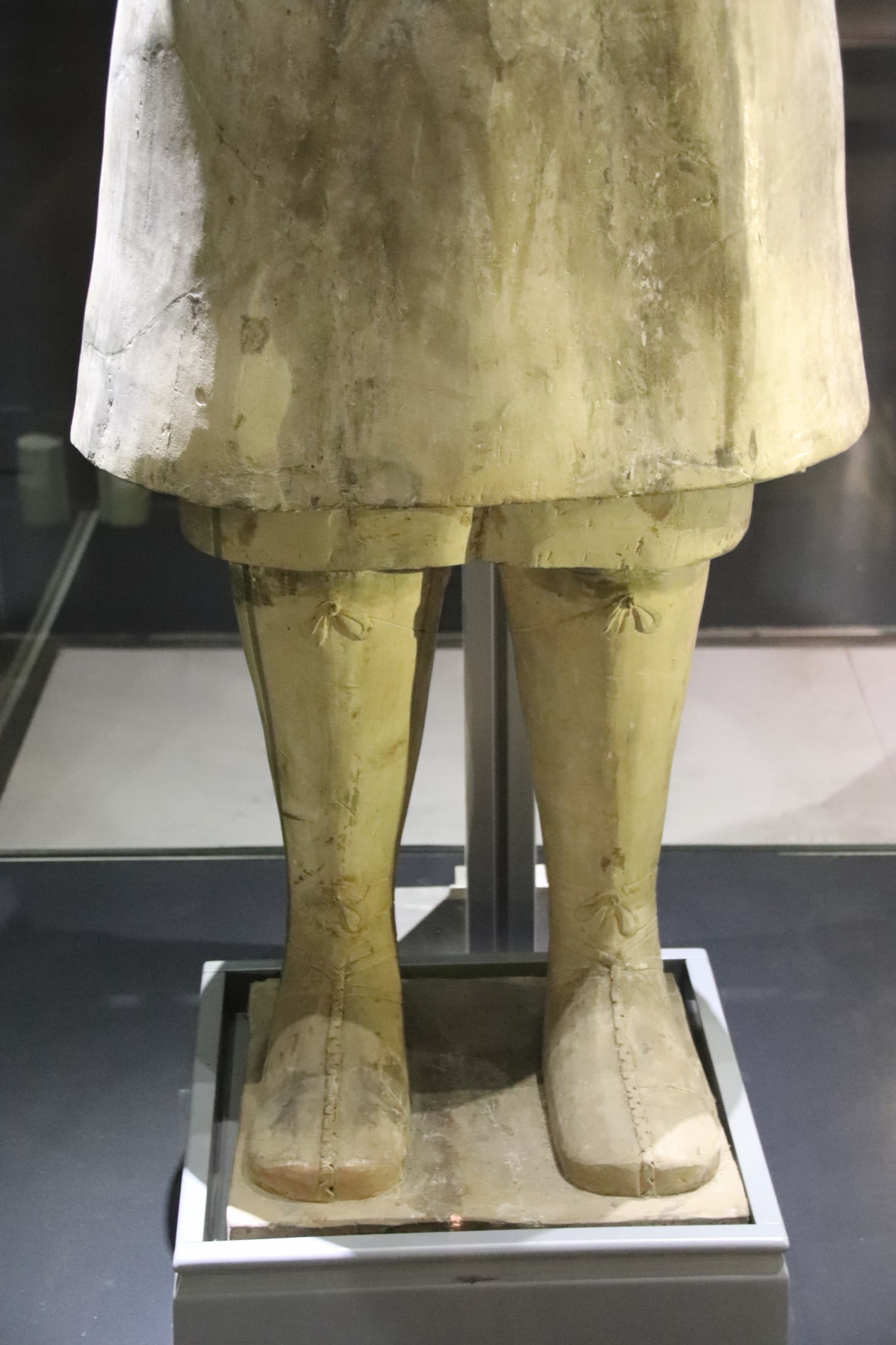 Modelled boots and lower garment of a terracotta warrior