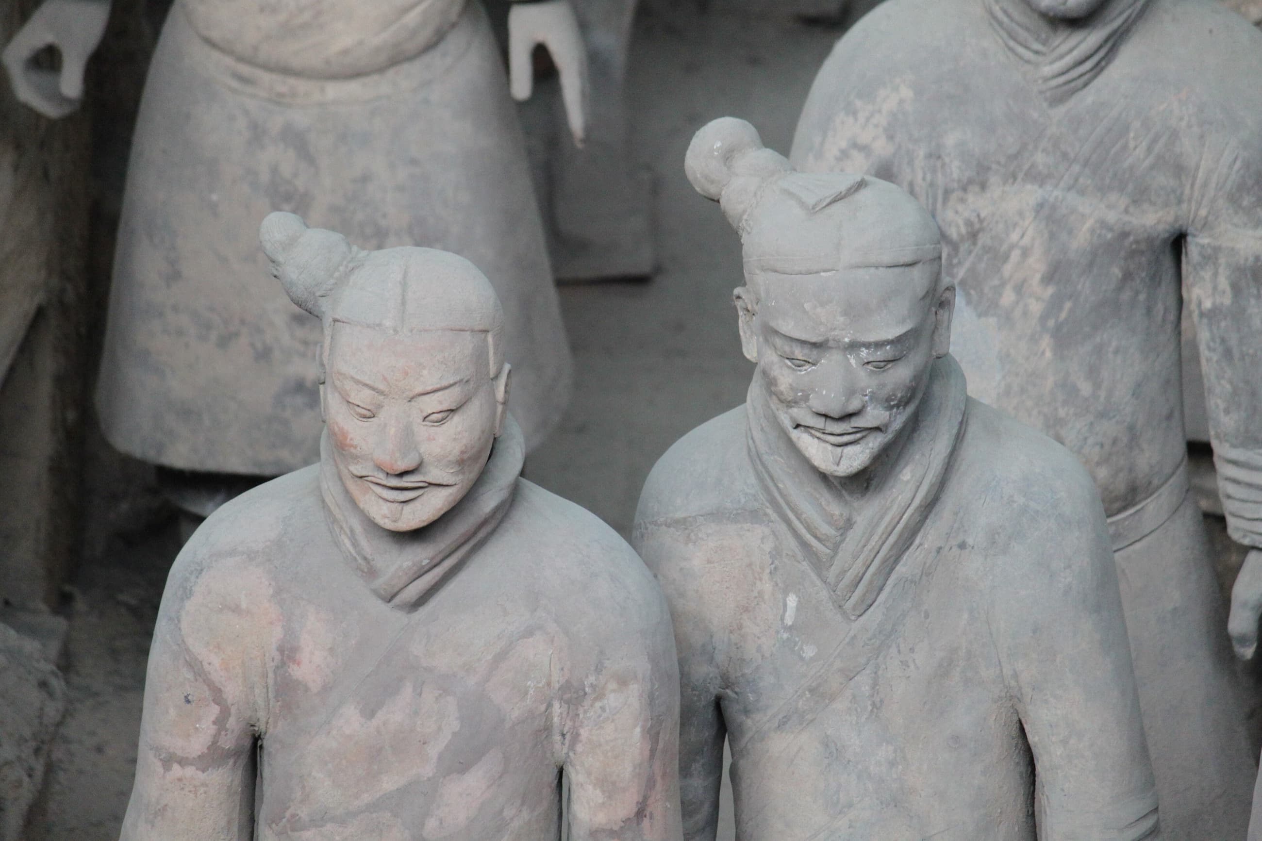 Close view of the modelled face and hair of a terracotta warrior