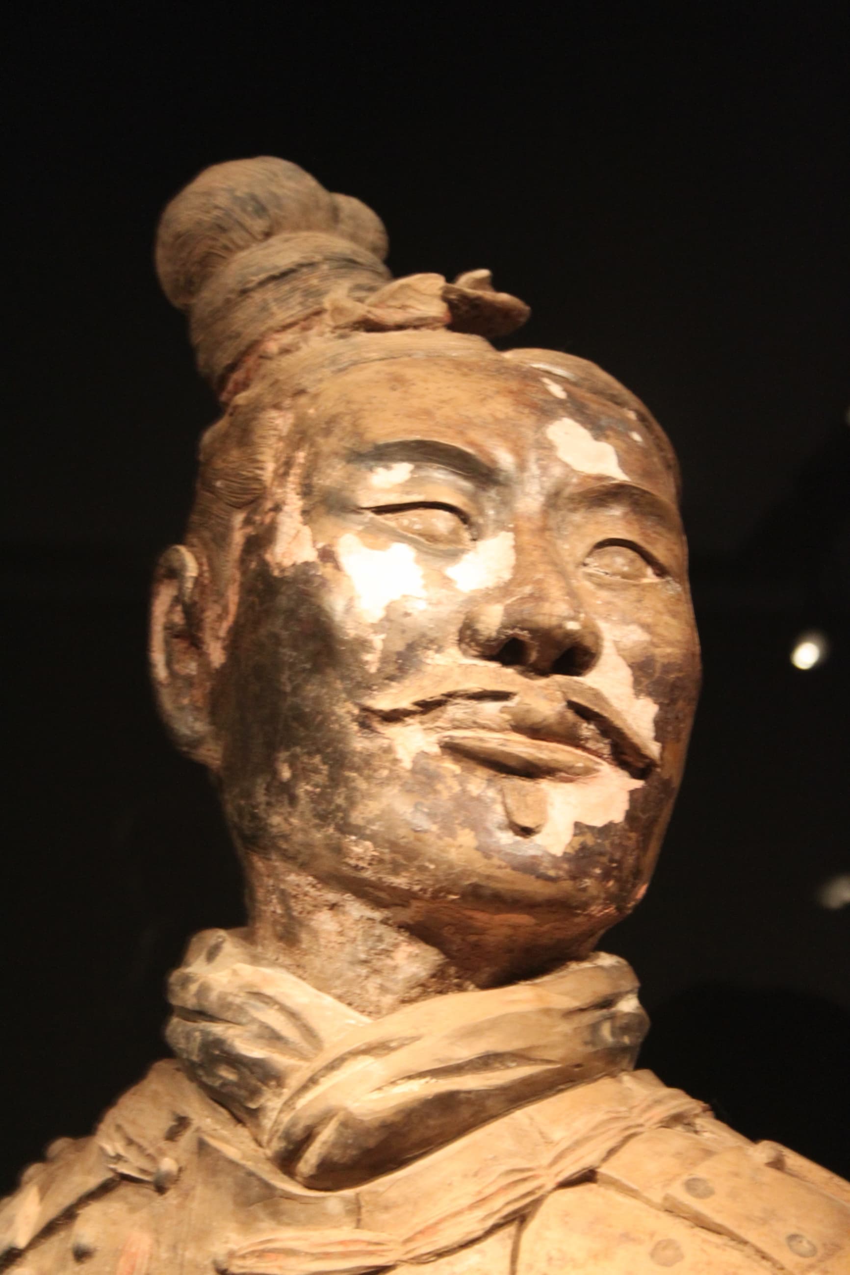Ancient kneeling archer with visible surviving original pigments